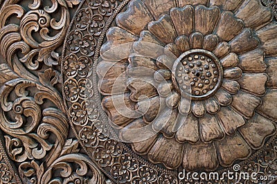 Pattern of flower carved on wood background Stock Photo