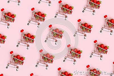 Pattern of fresh strawberry in shopping cart on pink background. Online shopping, Valentines Day minimalistic concept. Stock Photo