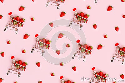 Pattern of fresh strawberry in shopping cart on pink background. Online shopping, Valentines Day minimalistic concept. Stock Photo