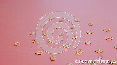 Pattern of grains of oats on a pink background. Stock Photo