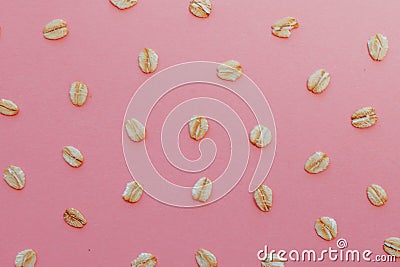 Pattern of grains of oats on a pink background. Stock Photo