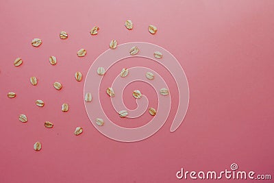 Pattern of grains of oats on a pink background. Stock Photo