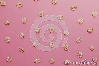 Pattern of grains of oats on a pink background. Stock Photo