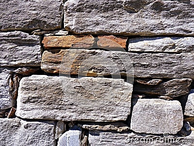 Pattern gray color of retro style decorative uneven stacked cracked real stone wall surface Stock Photo