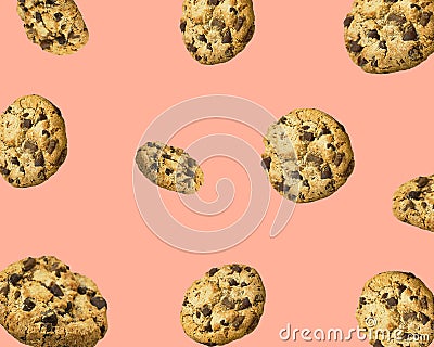 Pattern from homemade chocolate chips cookies flying in air on pink background. Baking kids birthday party sweets concept Stock Photo