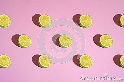 Pattern of lime citrus fruit slices on pink background, creative design seamless texture Stock Photo