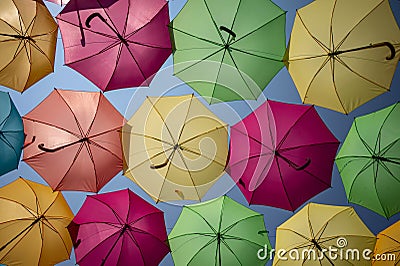 Pattern of multiple colored umbrellas in random order. Stock Photo