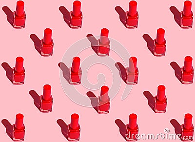 Pattern from red nail polish bottles arranged in symmetrical geometric rows on fuchsia pink background. Pop art style Stock Photo