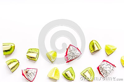 Pattern with sliced kiwi and pitaya on white background top view mockup Stock Photo