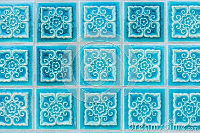 Pattern of turquoise flower glazed tiles. Stock Photo