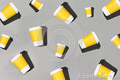 Pattern yellow cardboard coffee cup on pastel background. Flat style. Creative background packaging mockup template Stock Photo