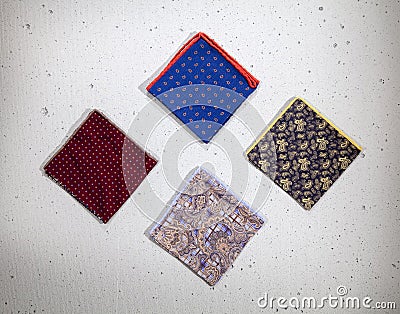 Patterned folded colorful handkerchiefs isolated on white background Stock Photo