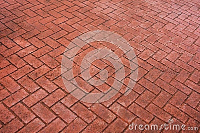 Patterned paving tiles, old red cement brick floor. Stock Photo