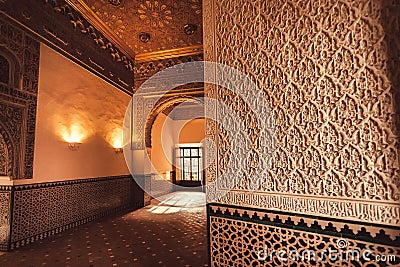 Patterned walls inside 14th century Alcazar royal palace in Mudejar architecture style, Seville. Spain Editorial Stock Photo