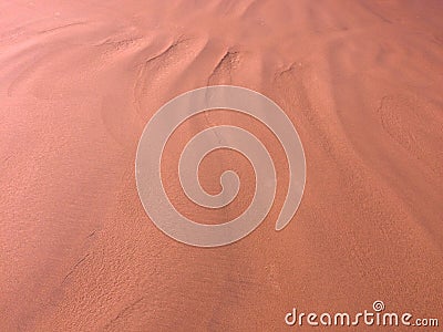 Patterns from the waves and wind on the sand, sand of an unusual color Stock Photo