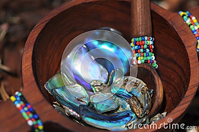 Paua shell pieces in handcrafted beaded wooden bowl Stock Photo