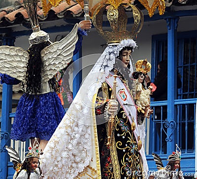 PAUCARTAMBO demons and devils called SAGRAS climbed to the balconies of the town trying to tempt the Virgin of Carmen with Editorial Stock Photo