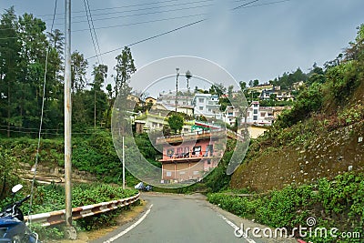 Pauri, Garhwal, Uttrakhand, India - 3rd November 2018 : Monsoon on the hilly streets of Pauri. Rainy street image of busy town on Editorial Stock Photo