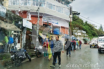 Pauri, Garhwal, Uttrakhand, India - 3rd November 2018 : Monsoon on the streets of Pauri. Rainy street image of busy town on the Editorial Stock Photo