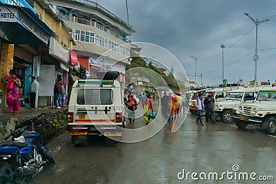 Pauri, Garhwal, Uttrakhand, India - 3rd November 2018 : Monsoon on the streets of Pauri. Rainy street image of busy town on the Editorial Stock Photo