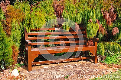 Pause for a moment (wooden bark bench) Stock Photo