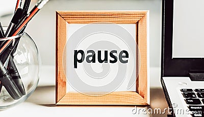 Pause. Work, study, break and rest concept. Text on a frame with an office tolls Stock Photo