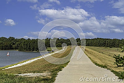 Paved path on top of a levy at Ed Zorinsky lake Stock Photo