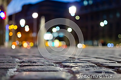 Pavement and blurred city light during night time Stock Photo