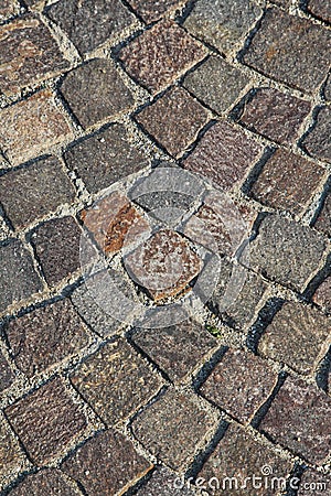 The pavement of a city street made of rectangular stone blocks, pavers Stock Photo