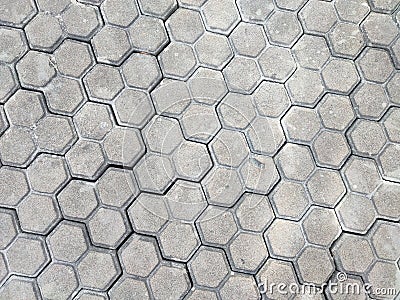 Pavement hexagonal stone background. Hexagonal paving cobble texture laid on city street Stock Photo