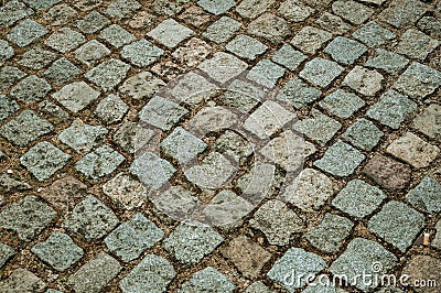 Pavement made of granite setts forming a singular background Stock Photo