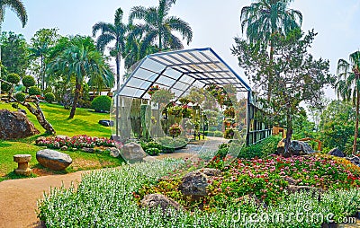 Pavilion with ampelous flowers, Mae Fah Luang garden, Doi Tung, Thailand Stock Photo