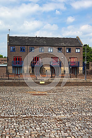 Paving and terrace house in Docklands. London. UK Stock Photo