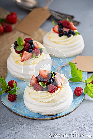 Pavlova cakes with cream and fresh berries Stock Photo