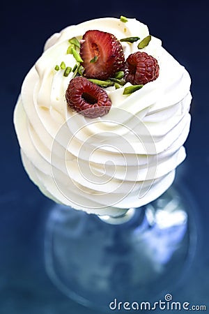 Pavlova cakes with cream and fresh summer berries. Pavlova cakes Stock Photo