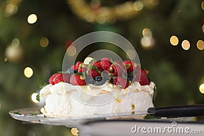 Pavlova with cream & berries, a favourite Australian dessert at Christmas time. Stock Photo