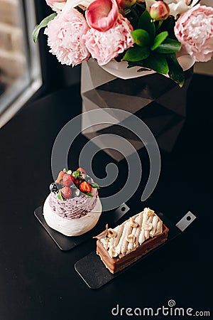 Pavlova dessert made of fresh meringue with cream cheese decorated with berries Stock Photo