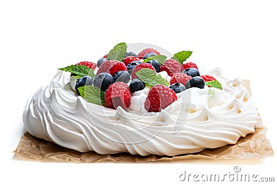 Pavlova meringue nest with berries and mint leaves isolated on white Stock Photo