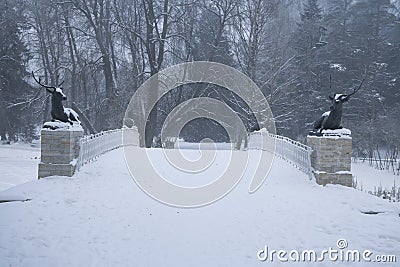 Deer bridge with figures of lying deer covered with frost in winter Editorial Stock Photo