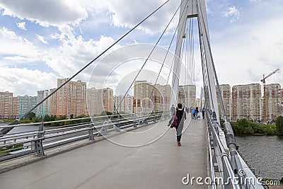 Pavshinsky Bridge also bridge Pavshinskaya Poima or Spassky Bridge is pedestrian cable-stayed bridge across Moskva River. Editorial Stock Photo