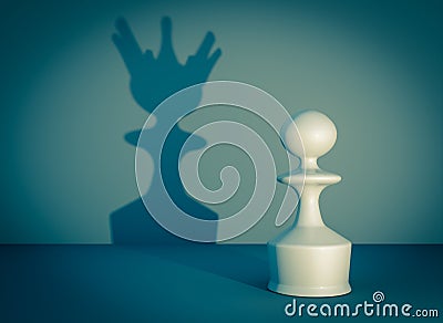 Pawn of the chess game with queen shadow Stock Photo