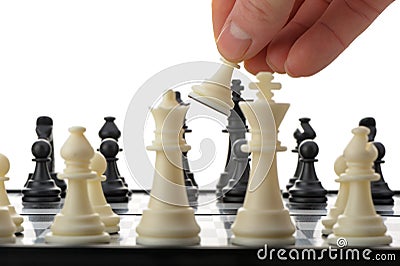 Pawn in hands over a chessboard Stock Photo