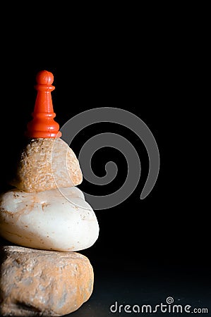 pawn on stone and back backgrouund Stock Photo