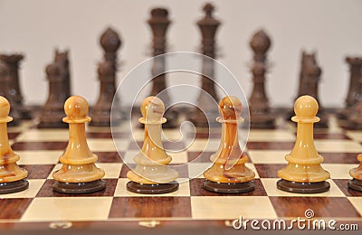 Pawns on chess board Stock Photo