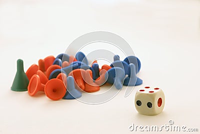 Pawns and a dice Stock Photo