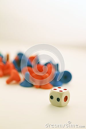 Pawns and a dice Stock Photo