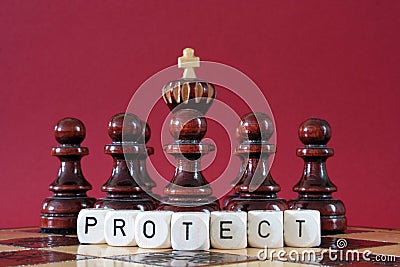 Pawns protecting chess king Stock Photo