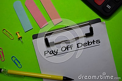 Pay Off Debts write on a paperwork isolated on Office Desk Stock Photo