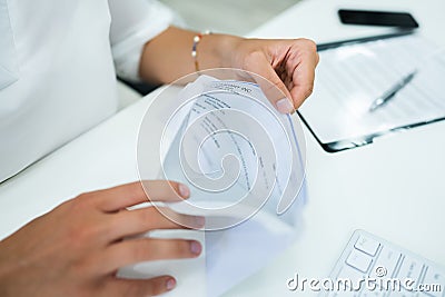 Paycheck In Open Envelope Stock Photo