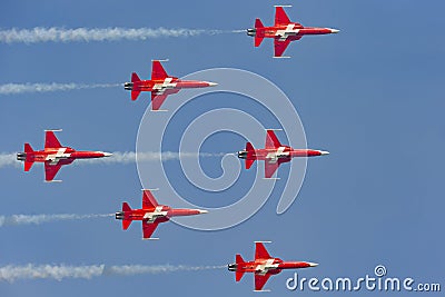 Patrouille Suisse formation display team of the Swiss Air Force flying Northrop F-5E fighter aircraft joined by the Swiss PC-7 tea Editorial Stock Photo